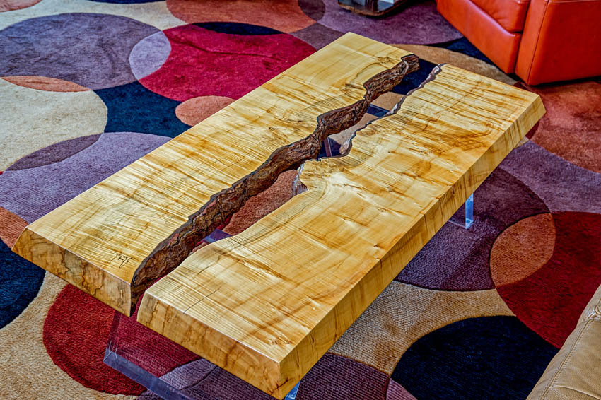 DRACO Design and Construction A coffee table made out of wood.